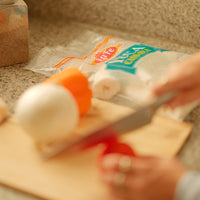 Preparing fresh ingredients with La Fe Yuca, perfect for authentic Latin food recipes and flavors.