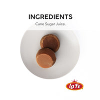 Round Fela Panela made from cane sugar juice, showcasing authentic Latin flavor for your culinary creations.