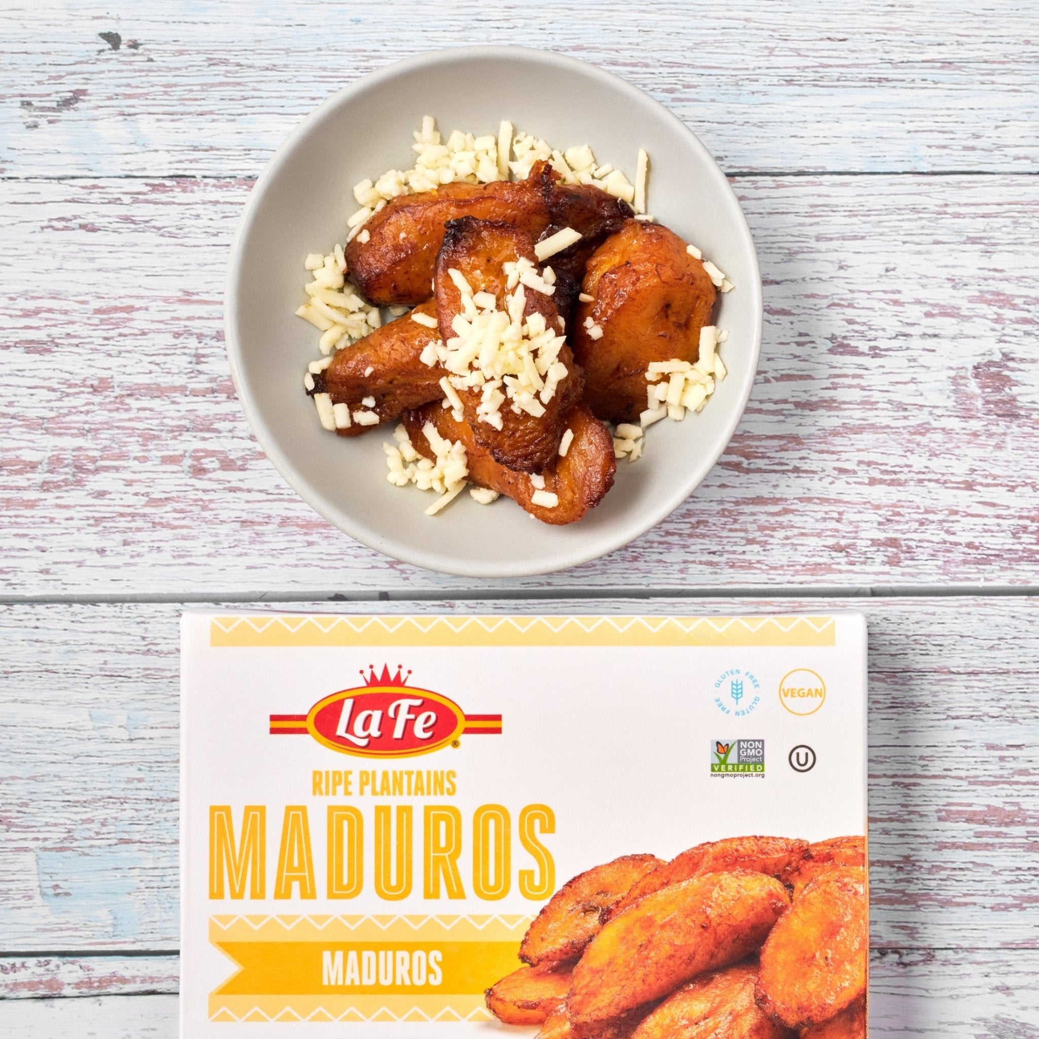 Delicious LA FE Platanos Maduros served with cheese, showcasing authentic Latin flavors and quality fresh food.
