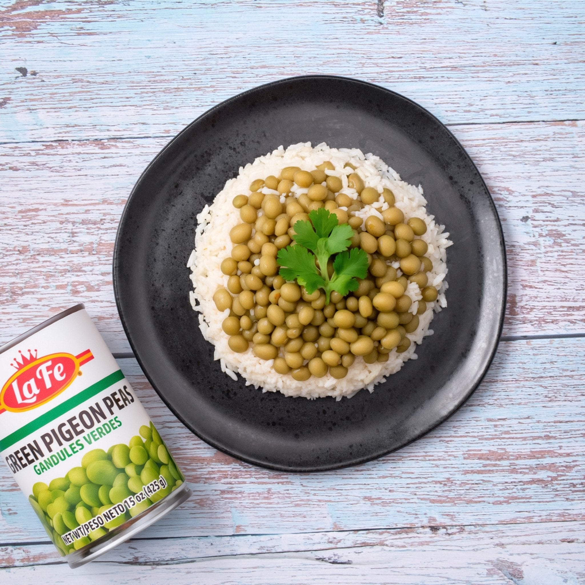 Plate of rice topped with La Fe green pigeon peas, a flavorful Latin food staple for authentic cooking.