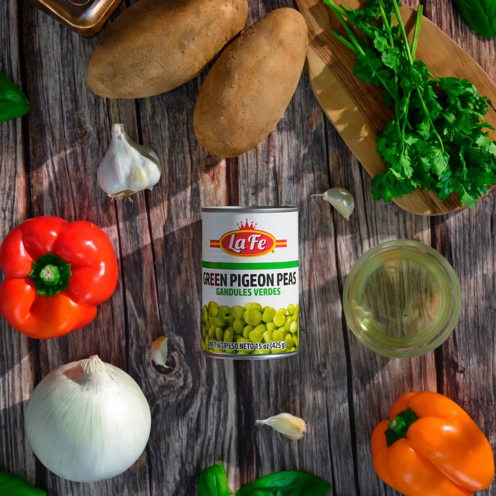 La Fe Green Pigeon Peas surrounded by fresh vegetables, perfect for authentic Latin meals and cooking essentials.