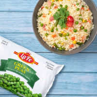 La Fe Green Peas package with bowl of rice dish featuring peas, perfect for nutritious Latin meals.