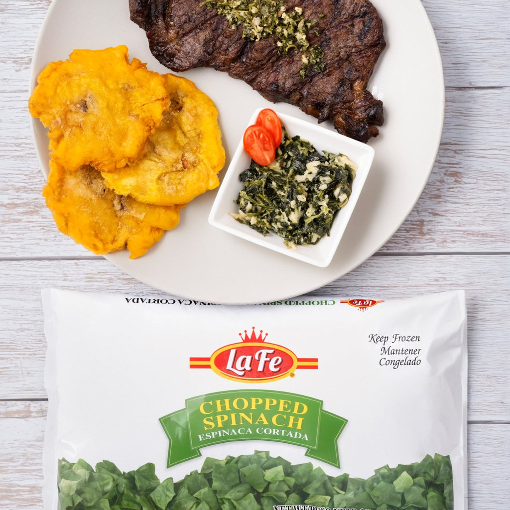 La Fe Chopped Spinach served with grilled steak and tostones, showcasing quality Latin flavors in a gourmet meal.