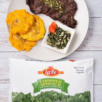 La Fe Chopped Spinach served with grilled steak and tostones, showcasing quality Latin flavors in a gourmet meal.