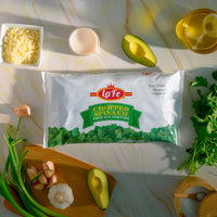 La Fe Chopped Spinach pack surrounded by fresh ingredients, perfect for healthy, authentic Latin cooking and recipes.