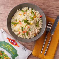 La Fe Mixed Vegetables served with rice, showcasing vibrant colors and authentic Latin flavors, perfect for meals.