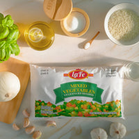 La Fe Mixed Vegetables bag showcasing vibrant colors, perfect for authentic Latin food dishes. Quality frozen vegetables for flavorful meals.