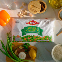 La Fe Peas & Carrots 32 oz bag on a kitchen table with fresh ingredients, perfect for authentic Latin meals.