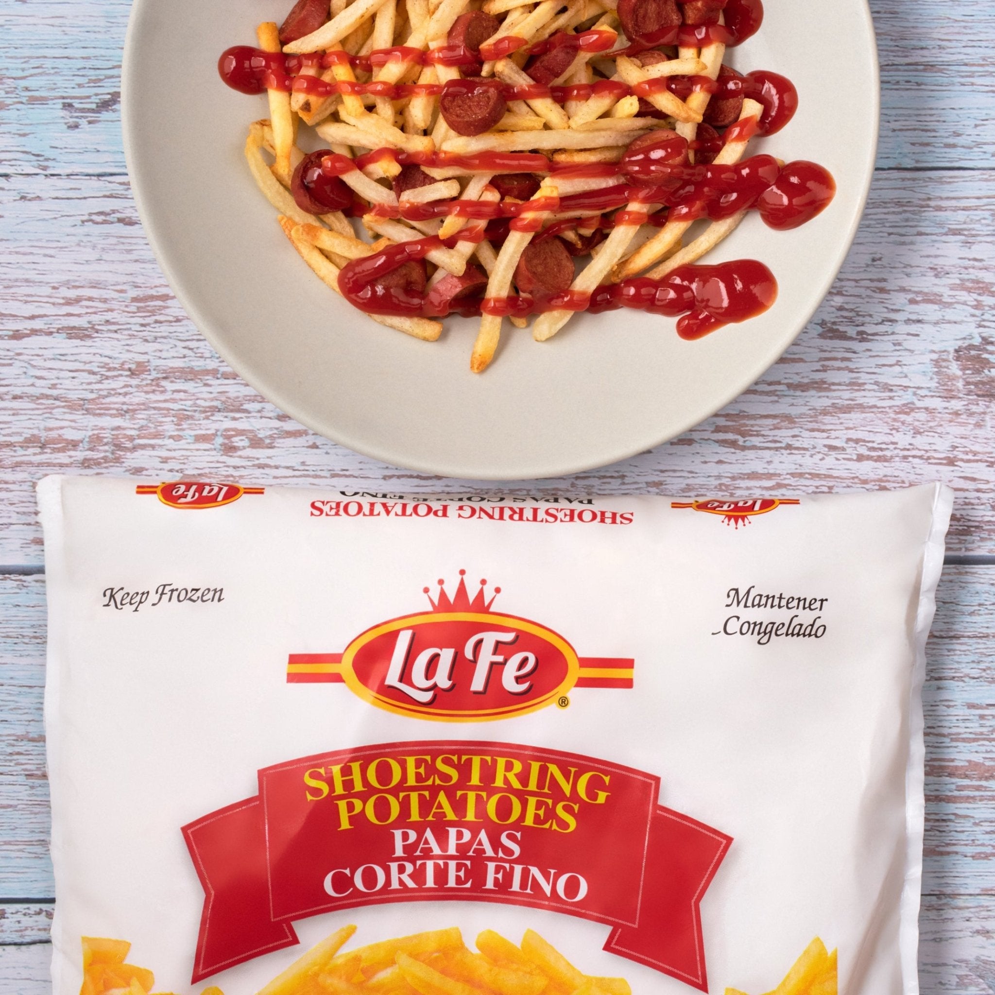LA FE FRIES SHOESTRING with ketchup on a plate, showcasing delicious flavors of authentic Latin food.