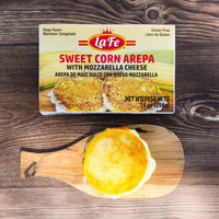 LAFE Sweet Corn Arepa with Mozzarella Cheese on a wooden board, gluten-free frozen Latin food product.