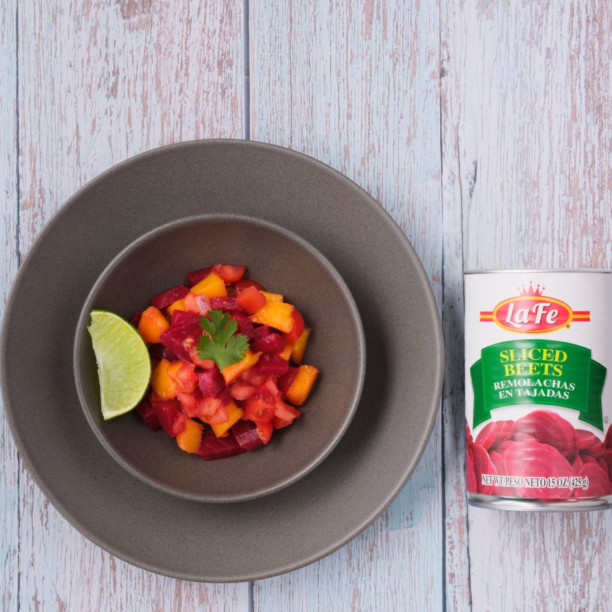 Delicious La Fe sliced beets served with fresh veggies and lime for authentic Latin flavors in vegetarian meals.