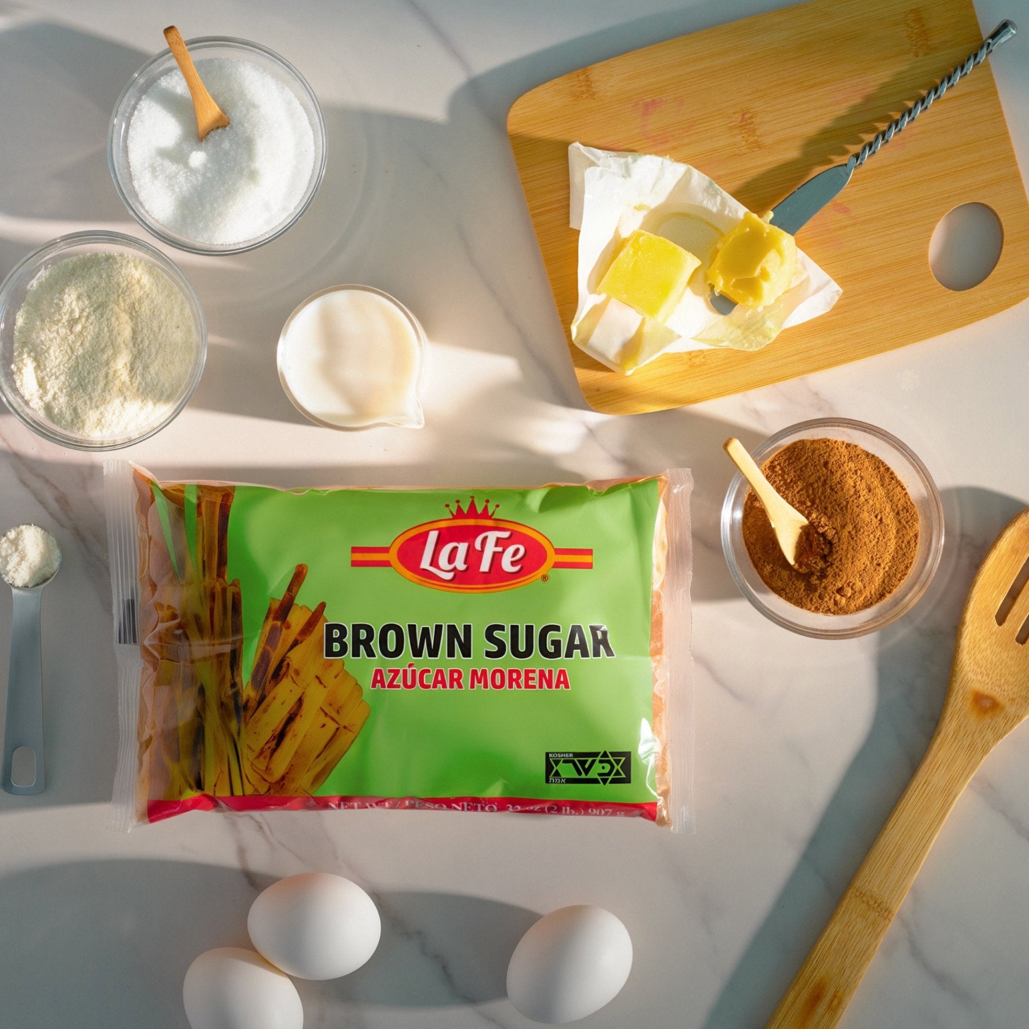 La Fe Brown Sugar bag surrounded by ingredients for cooking, perfect for Latin recipes and quality culinary creations.