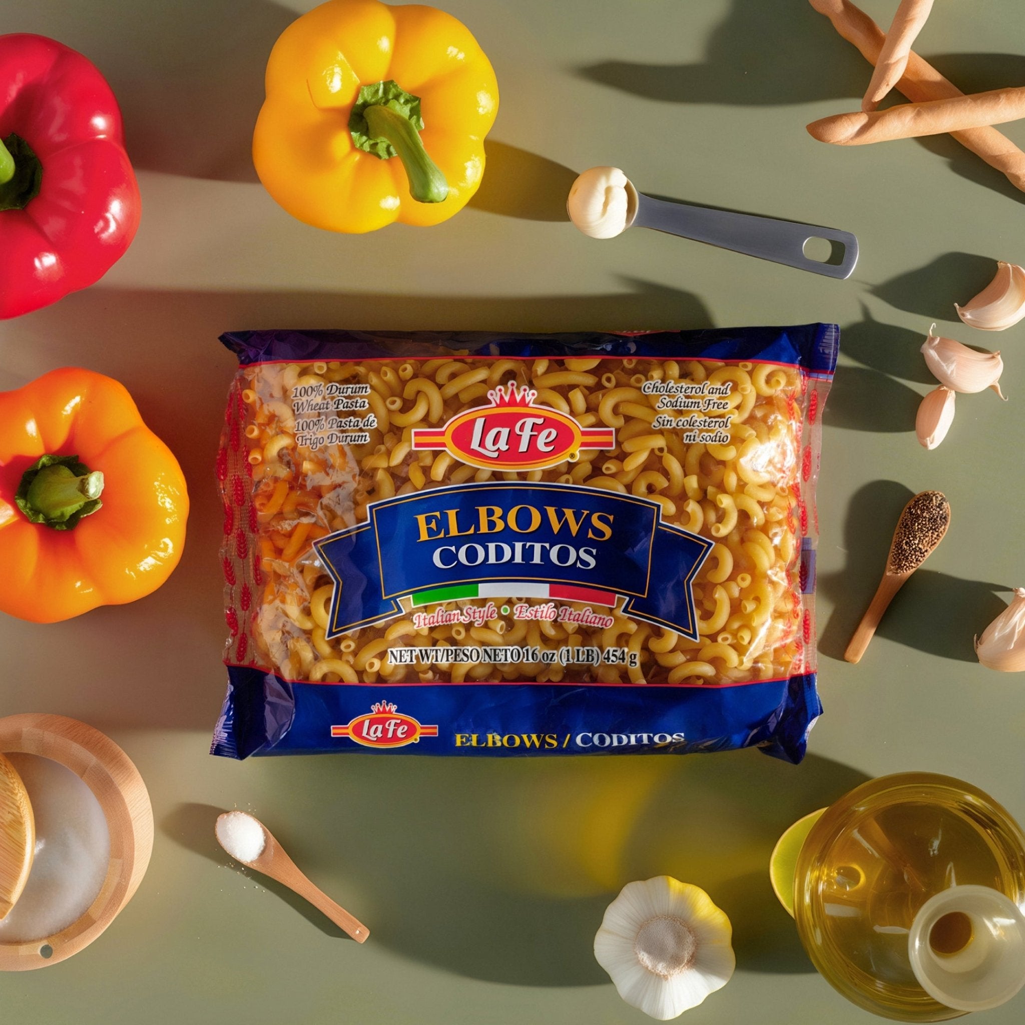 LA FE Elbows Pasta in vibrant packaging with fresh peppers and ingredients, perfect for authentic Latin food recipes.