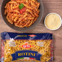 LA FE Pasta Rotini served in a bowl with tomato sauce and cheese, ideal for enjoying authentic Latin flavors.