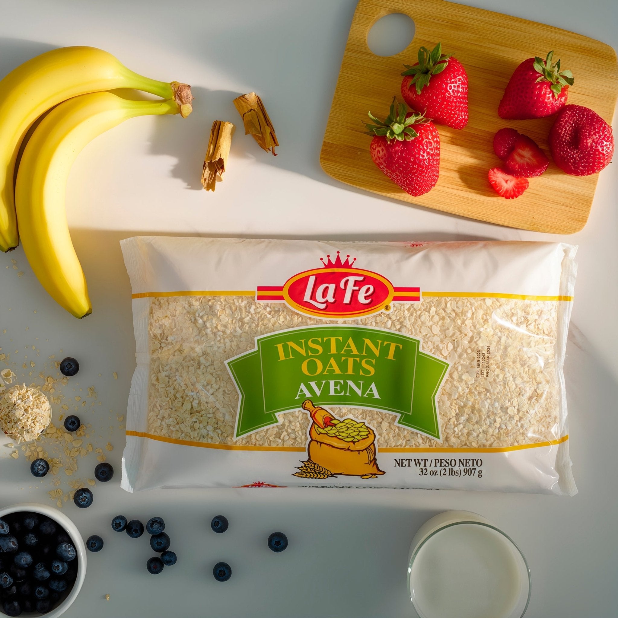 La Fe Instant Oats package with fresh bananas, strawberries, blueberries, and milk, perfect for nutritious Latin breakfast.