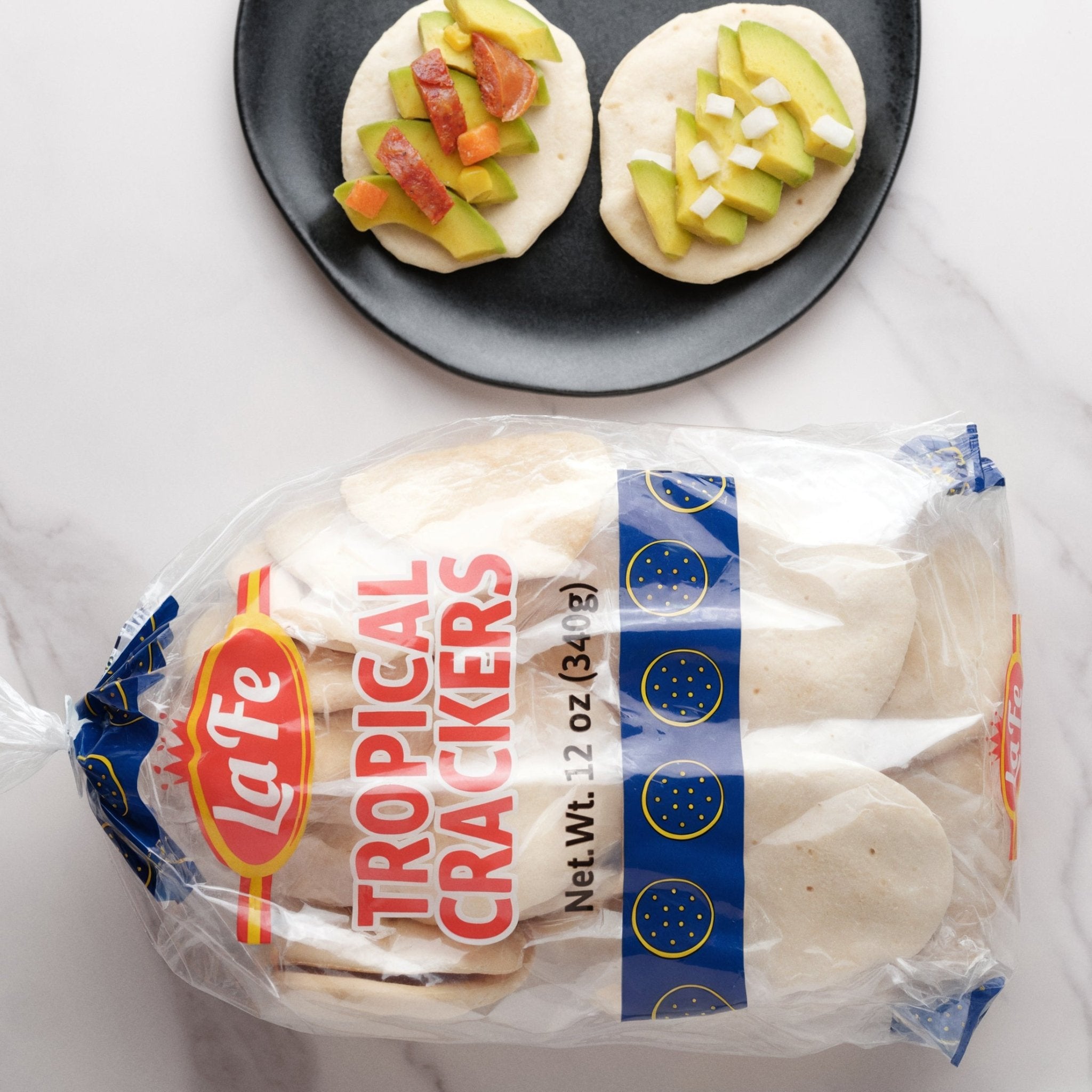 La Fe Tropical Crackers with tropical toppings, perfect for authentic Latin snacks and picnics.