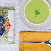 Delicious green split pea soup made with La Fe's high-quality dry green split peas, served with a vibrant garnish.