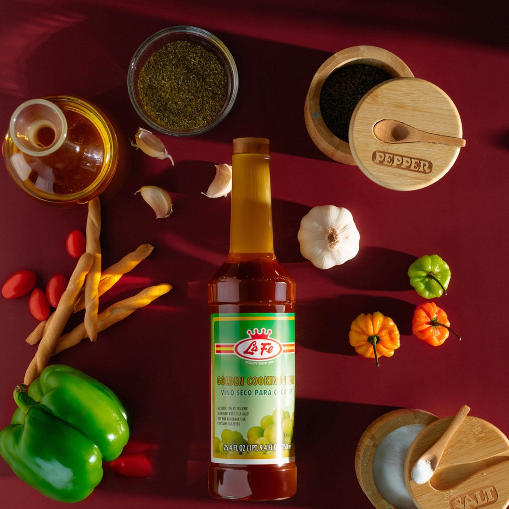 LA FE cooking sauce bottle surrounded by fresh ingredients, herbs, and spices for authentic Latin flavors.