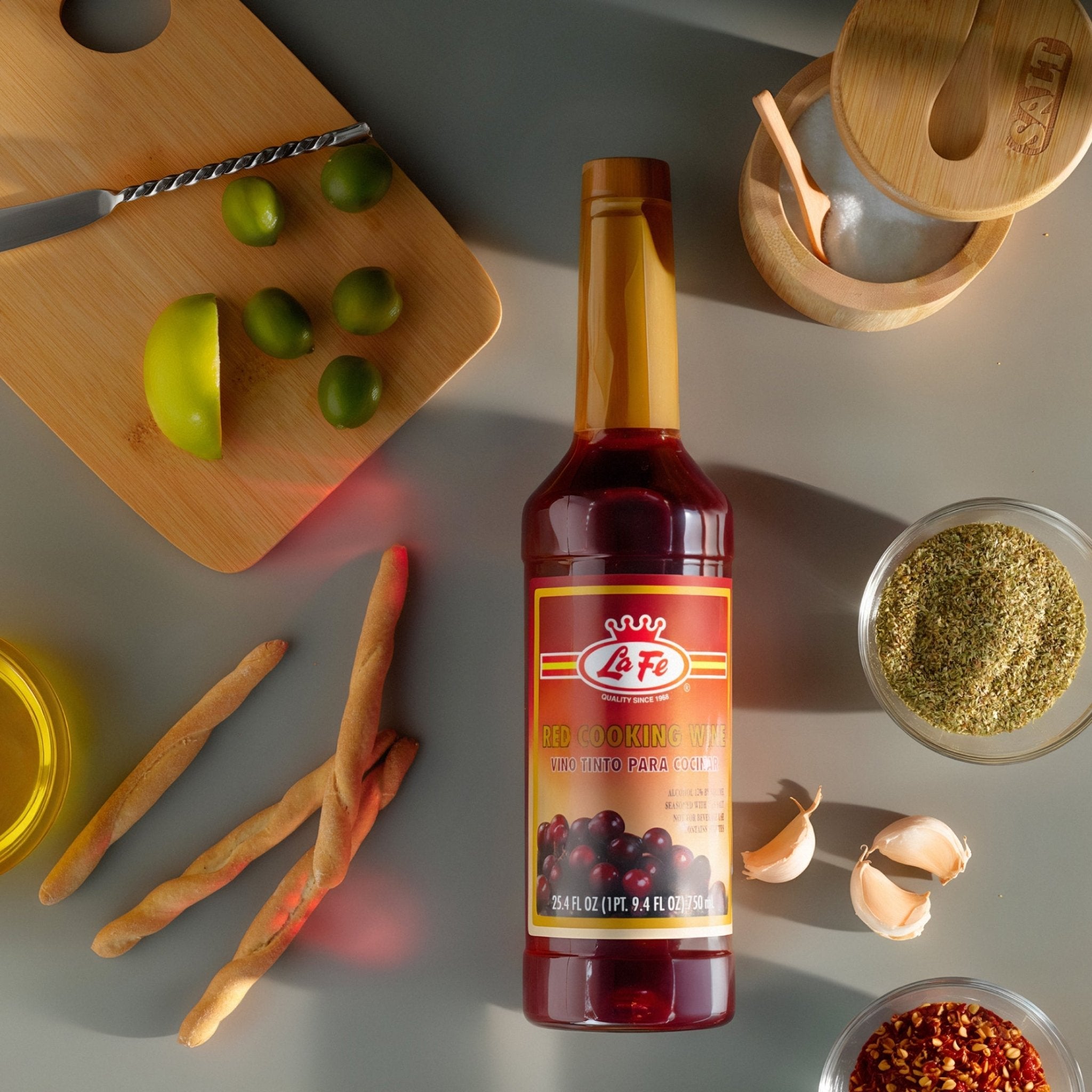LA FE red cooking wine bottle surrounded by fresh ingredients, ideal for enhancing authentic Latin American dishes.