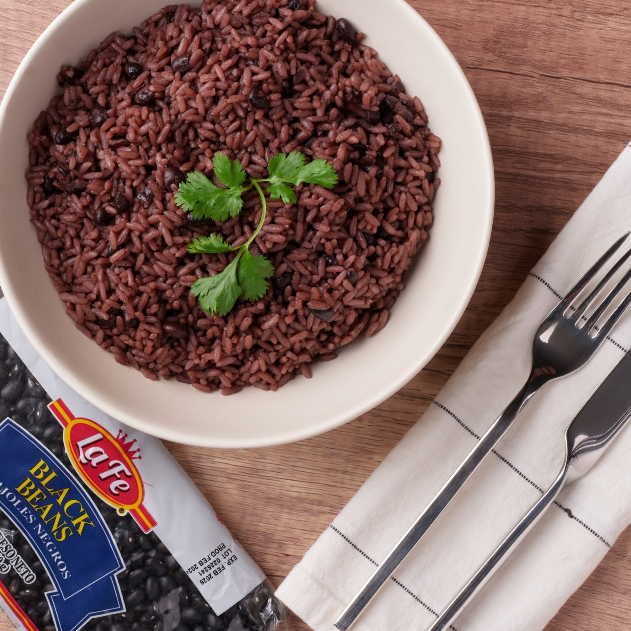 La Fe Dry Black Beans served with fresh cilantro, showcasing authentic Latin food flavors and quality ingredients.