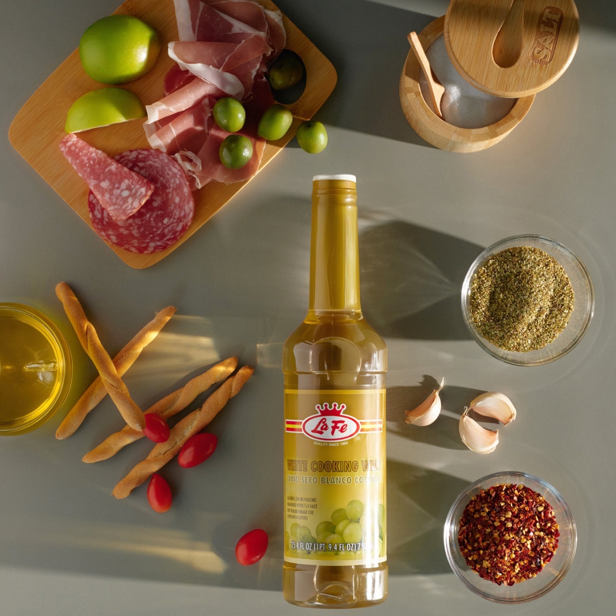 LA FE Cooking Wine White surrounded by fresh ingredients, perfect for enhancing authentic Latin flavors.