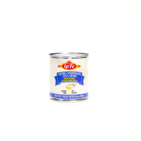 La Fe Sweetened Condensed Milk can, ideal for authentic Latin desserts and adds creamy texture to your favorite recipes.