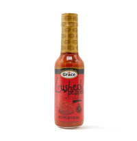 GRACE Crushed Pepper Sauce 5 oz bottle, perfect for adding bold, spicy flavors to authentic Latin dishes.