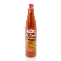 GRACE Hot Pepper Sauce bottle, spicy flavor elevating Latin food, 24/3 fl oz, authentic heat for vibrant meals.